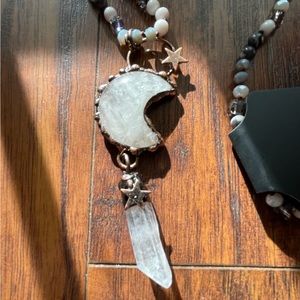 Moon necklace with crystal stone and beaded chain.